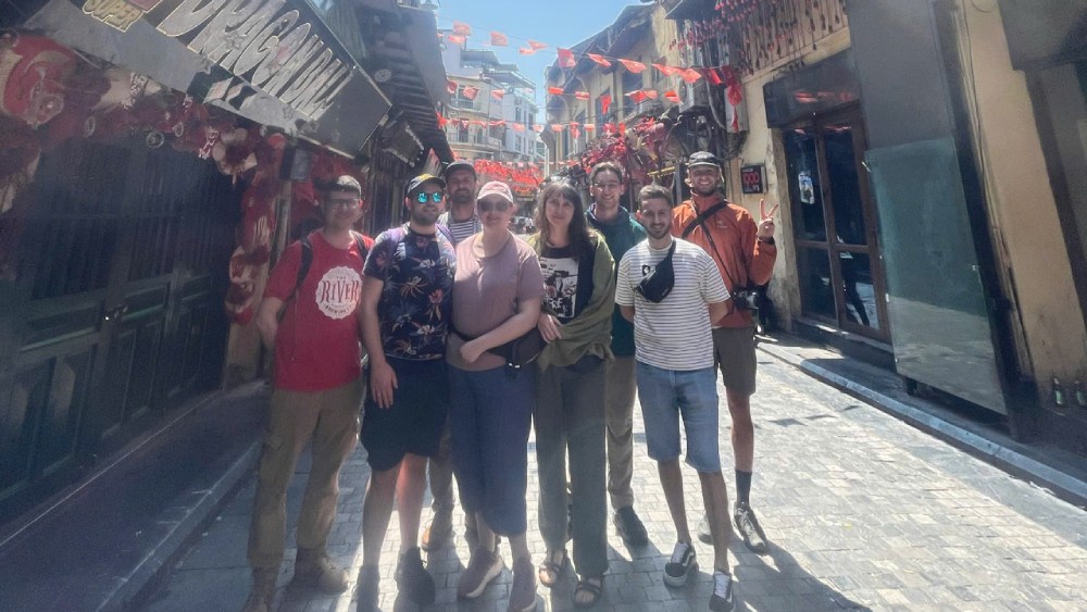 International guests exploring Ta Hien Beer Street during the Hanoi Old Quarter walking tour