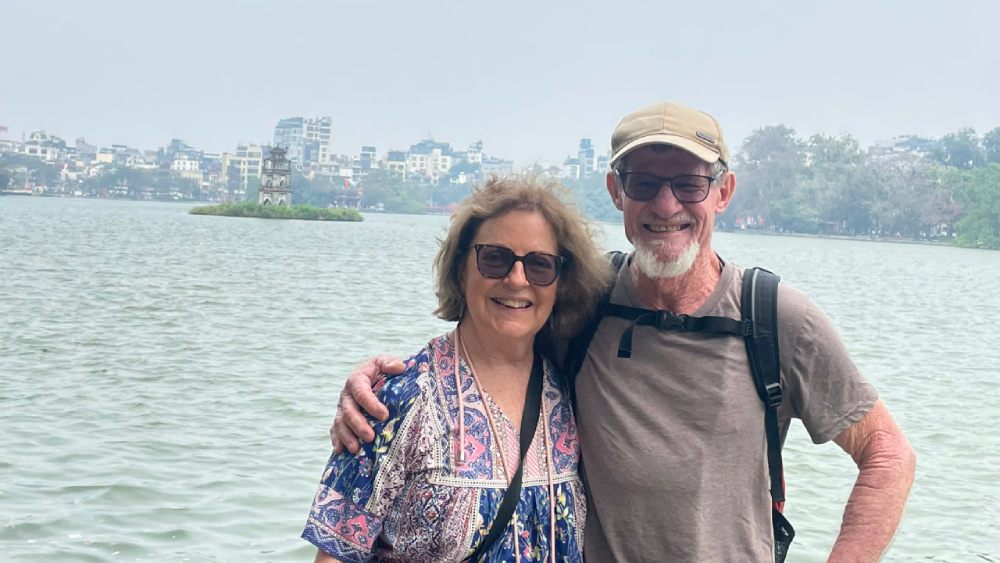 travelers visiting hoan kiem lake during a hanoi walking tour