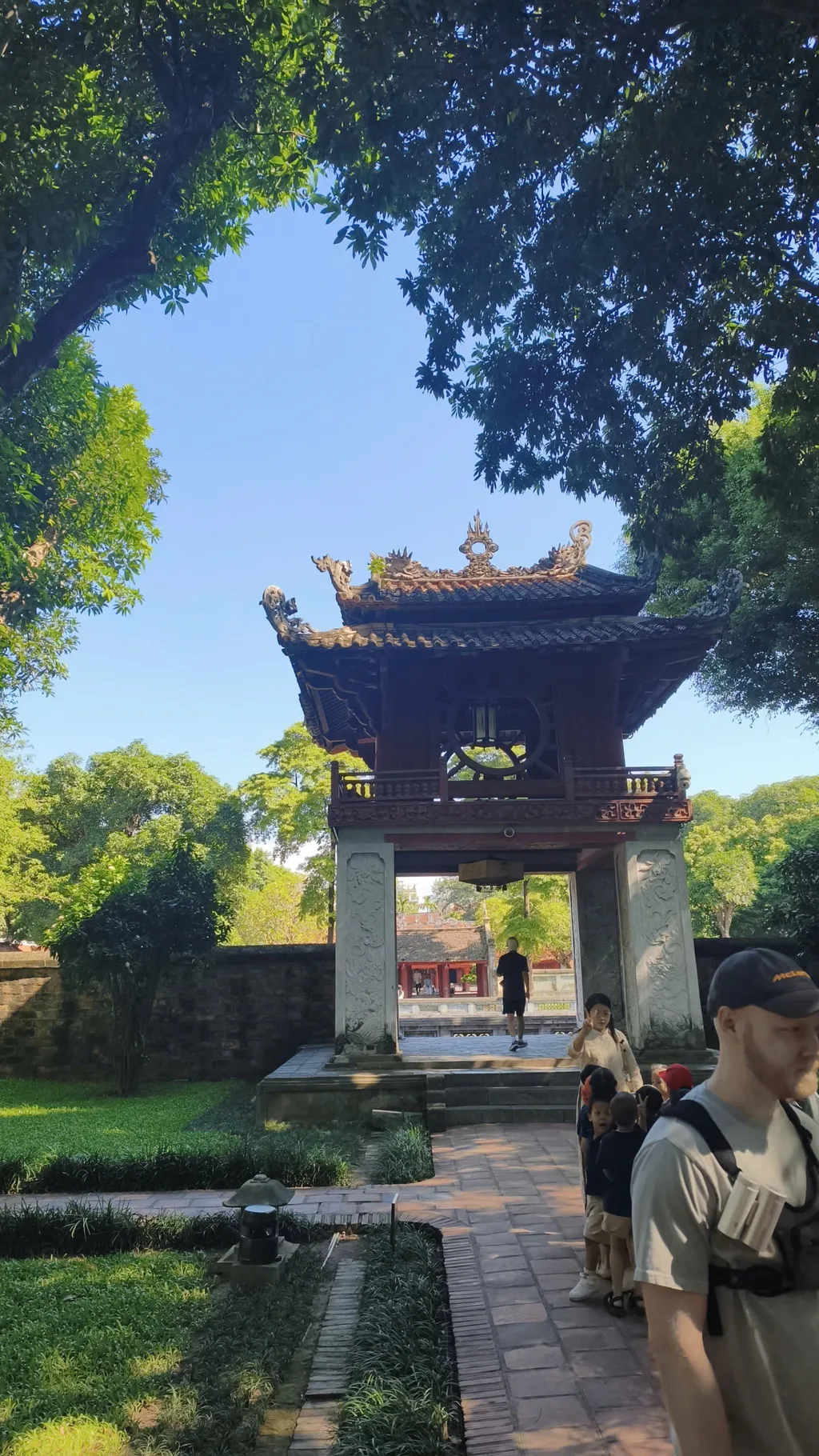 Khue Van Pavilion with red woodwork and stone pillars at the Temple of Literature.