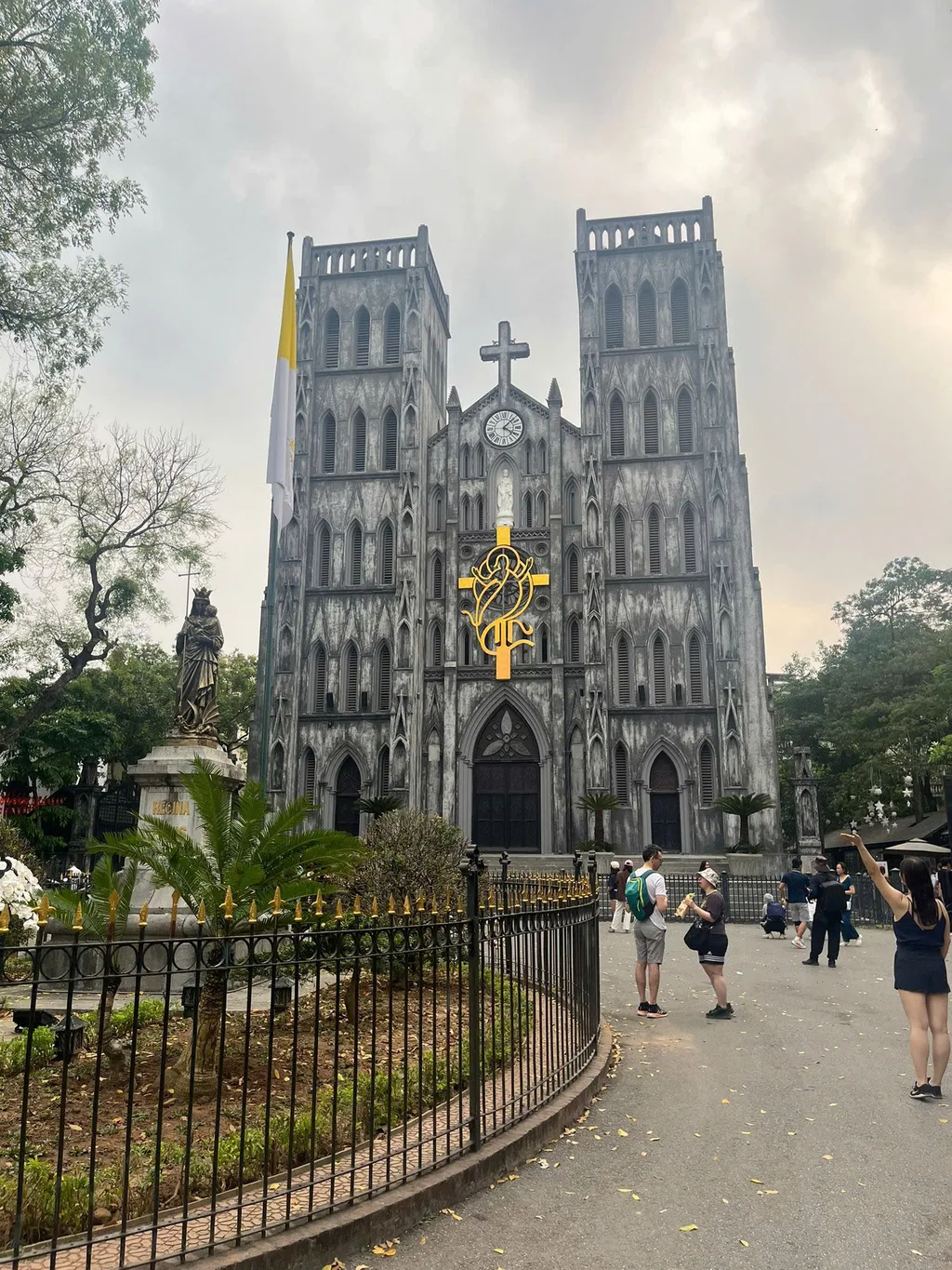 Neo-Gothic facade of St. Joseph's Cathedral and plaza in central Hanoi.