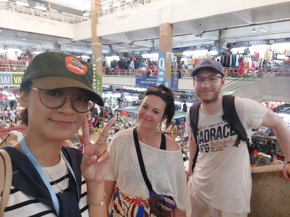 American travellers exploring Phung Hung Mural Street and Hanoi Old Quarter with guide Hannah.