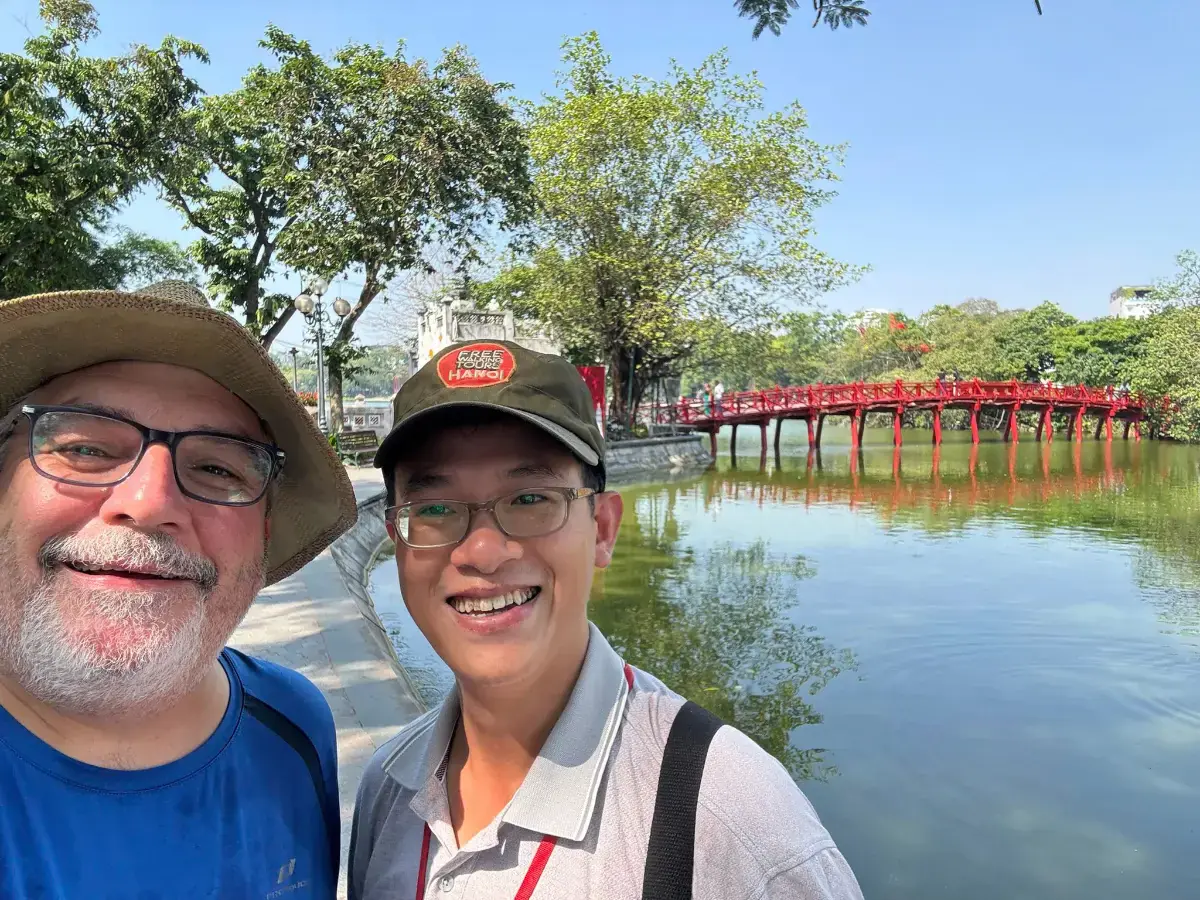 German traveller and local guide Hans at The Huc Bridge and Hoan Kiem Lake during a Hanoi walking tour.