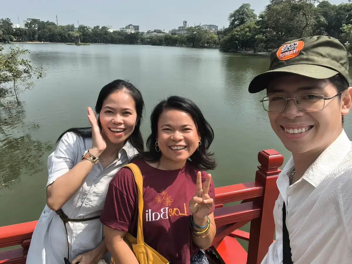 British traveller exploring Hanoi Train Street, Hang Ma Street and Old Quarter attractions with guide William.