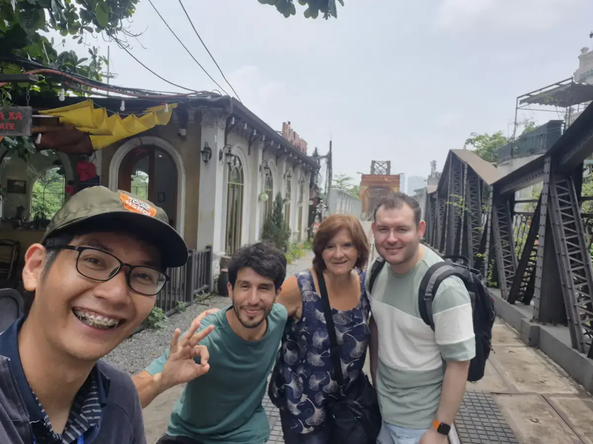 Spanish travellers visiting Dong Xuan Market and Hanoi Old Quarter with local guide Julio during a cultural walking tour.