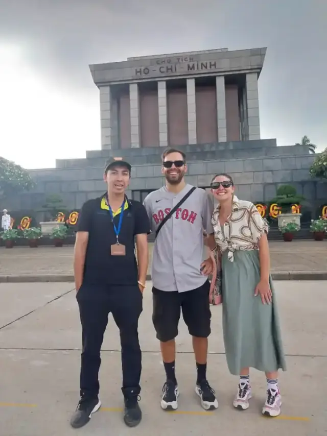 Local guide Luis with traveller Pilar from Andorra in front of the Ho Chi Minh Mausoleum during a Hanoi historical walking tour.