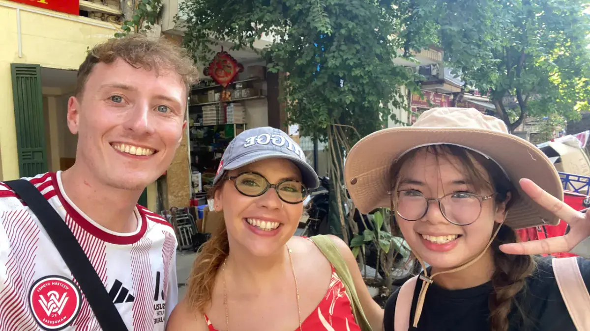 French traveller Bruna from Marseille and local guide Wendy on Ly Quoc Su Street near St Joseph Cathedral during a Hanoi walking tour.