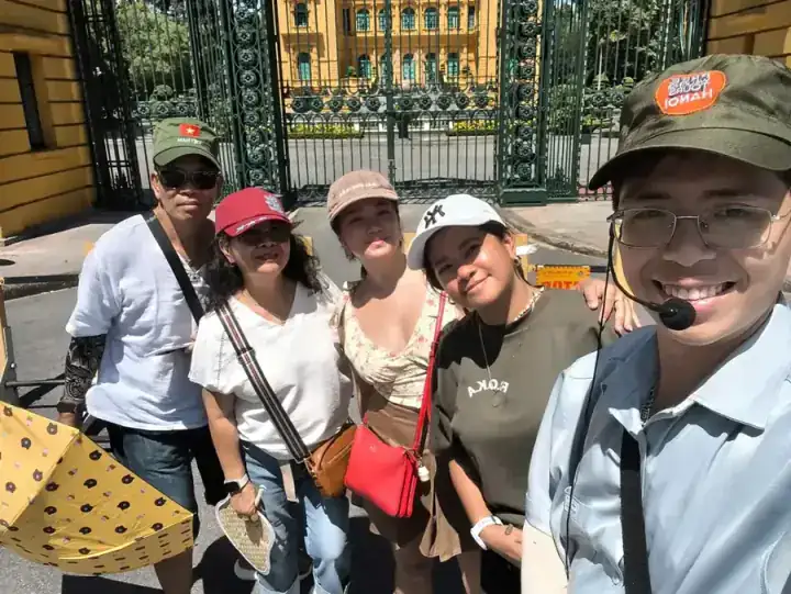 Guide William and guest Dayne Macasil from Indonesia exploring Hanoi historical landmarks near Tran Quoc Pagoda and the Temple of Literature.