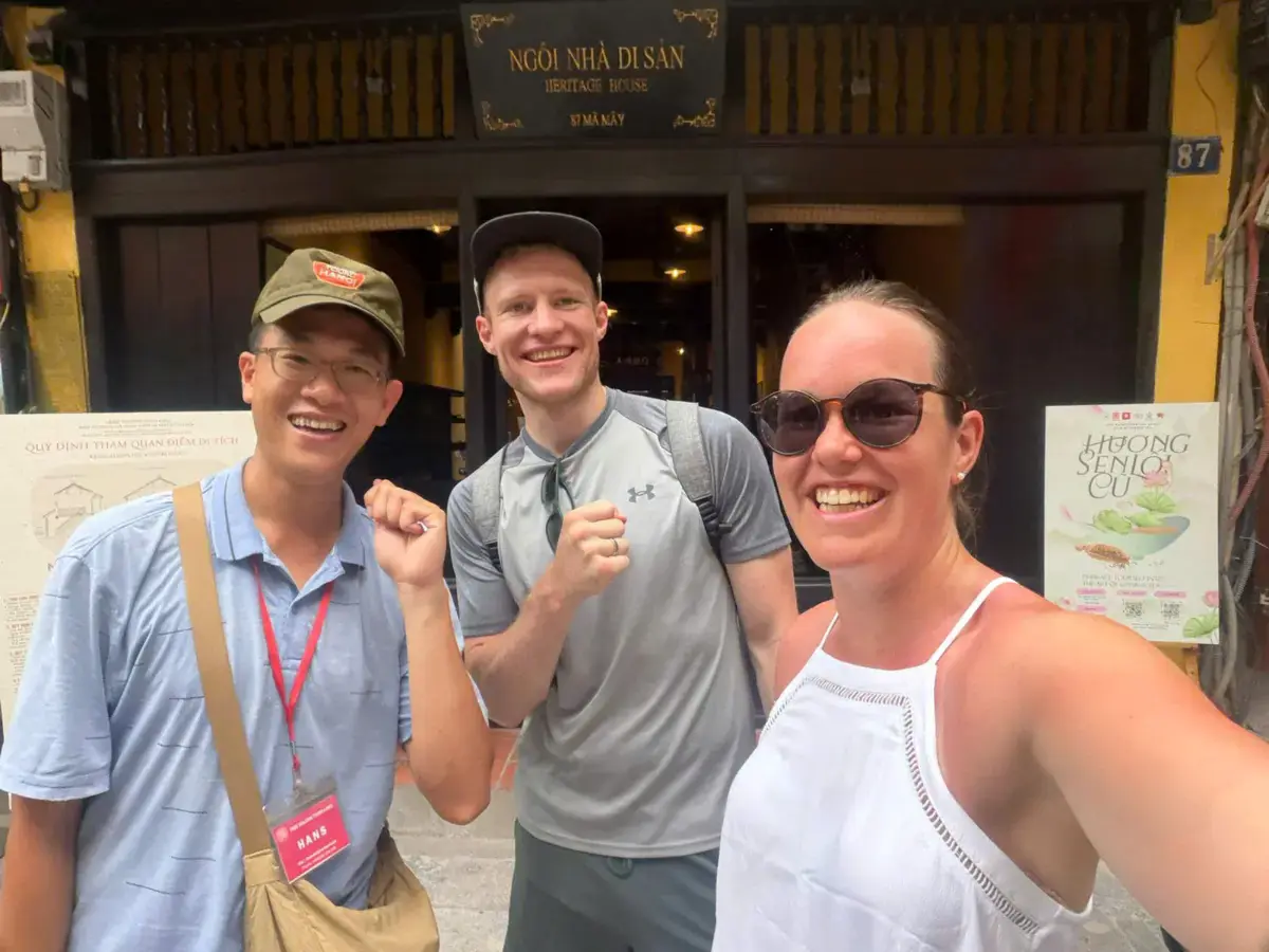 Guide Hans and Jennifer Hakmann from Germany at Hoan Kiem Lake, Thanh Ha Market, and Long Bien Bridge during a Hanoi walking tour.